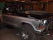 1979 Ford Bronco - This lifted Ford Bronco is parked in a garage, showing off its two-tone paint and tires.
