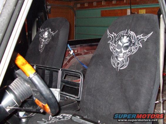 Interior view of a 1979 Ford Bronco with skull-themed seat covers