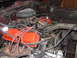 1979 Ford Bronco - A close-up view of a vehicle's engine compartment, showing various engine components and wiring.