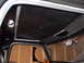 1979 Ford Bronco - Interior shot of a vehicle, focusing on the headliner and window area.