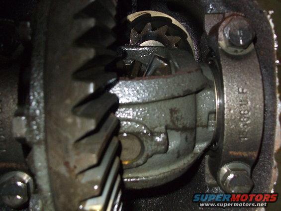 Close-up of differential gears and housing with part number visible