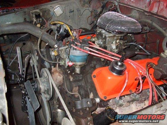 Engine bay with V8 engine, carburetor, and distributor