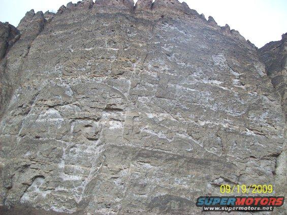 Rock face with date stamp 09/19/2009 and SuperMotors logo