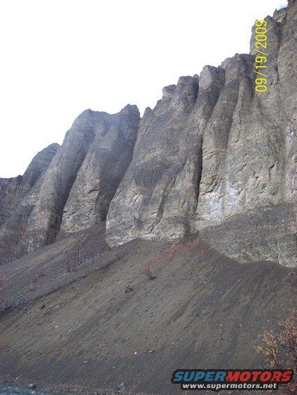 Rocky mountain landscape with a date stamp of 09/19/2009 and Supermotors.net watermark