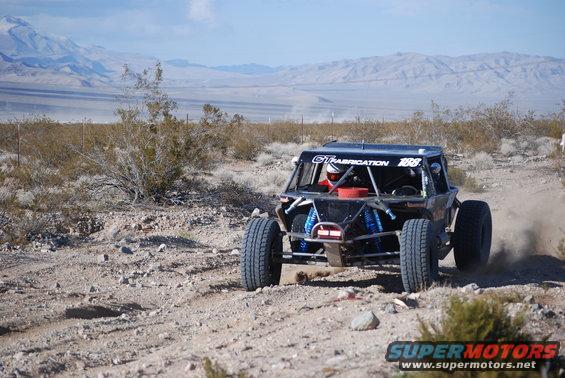 Rear view of off-road buggy with "GT FABRICATION 188" visible