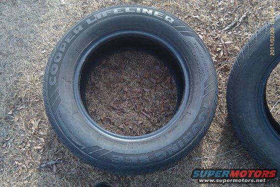 Cooper Lifeliner tire and another tire on the ground