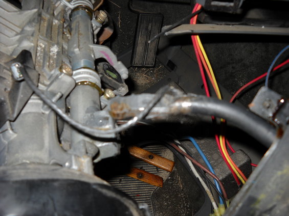 Steering column assembly with exposed wiring and pedals