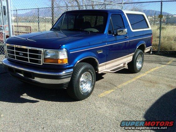 Blue and tan 1996 Ford Bronco 3/4 front view