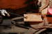 1972 Ford Ranchero - A close-up view of a bolt being secured to a vehicle's frame, showing rusty metal components.
