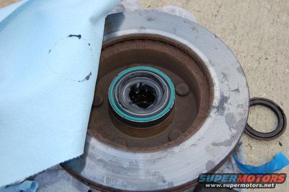 dsc_0065.jpg New wheel seal installed and bearing packed with grease. note the shop towel used to keep contaminants out.