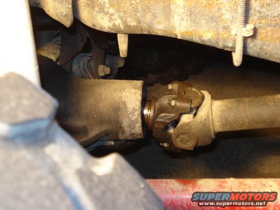 1985 Ford Bronco driveshaft and universal joint, rusty, close-up view