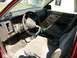 1994 Ford Explorer - The interior of a car is shown, cloth seats, a steering wheel, and dashboard instrumentation.