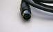 2003 Ford Taurus - This is a close-up of a 6-pin DIN connector on a black cable.