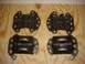 2001 Pontiac Trans Am - Four engine mounts are laid out on a wooden surface, ready for installation or inspection.