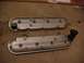2001 Pontiac Trans Am - Pair of silver valve covers, one with a black oil cap, resting on a concrete surface.