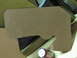 1993 Ford F-250 - A brown cardboard part, possibly a template or insulation, is shown next to a soda can and other materials.