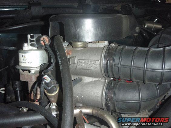 Engine intake manifold with "BSK" logo, air intake hoses, and a Ford A63 sensor