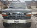 1993 Ford Bronco - Front view of a 1993 Ford Bronco a chrome grille and a heavy-duty aftermarket bumper with a winch.