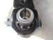 1995 Ford Bronco - A close-up view of a metal component, possibly a suspension part, with the marking 'F 1/2' visible.