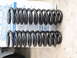 1995 Ford Bronco - Coil springs are shown on a box with text, suggesting they are automotive parts.