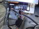 2003 Ford Taurus - Close-up of a vehicle's wiring harness and electronic control module, showing multiple connectors and wires.