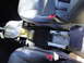 2003 Ford Taurus - Interior view of a car's center console, the gear shifter and an open ashtray.
