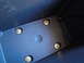 2003 Ford Taurus - Close-up view of a dark blue plastic interior component with visible mounting hardware.