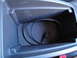 2003 Ford Taurus - Center console storage bin contains a black cable with a USB connector.