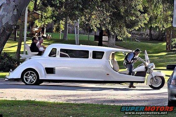 White custom limousine with motorcycle front and open rear seating