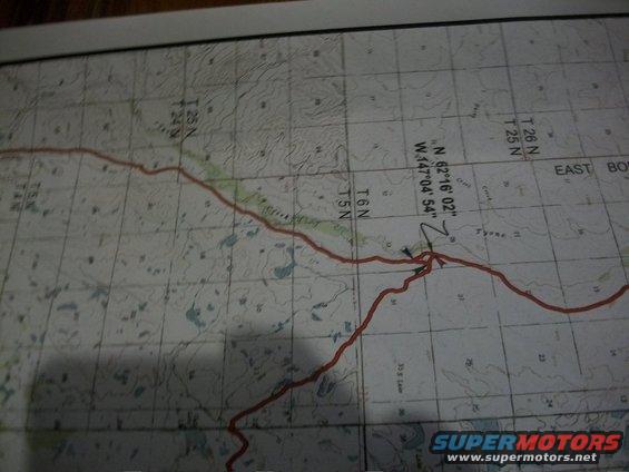 Topographic map showing a red route line with coordinates N 62°16'02" W.147°04'54"