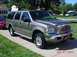 2002 Ford Excursion - Cleaned up with the Taurus in the background.