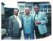 2003 Ford Crown Victoria - Three men pose for a photo in front of a suburban home.