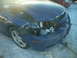 1993 Ford Probe - A blue car with significant front-end damage sits in the snow.