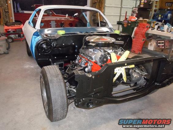 1970 Chevrolet Camaro body shell with engine installed, undergoing restoration