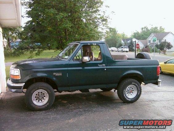 Green 1993 Ford Bronco parked outside
