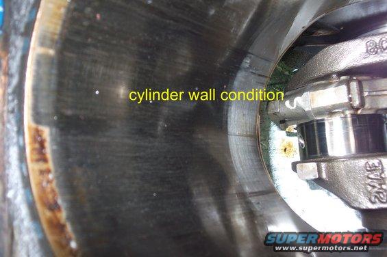 Engine cylinder wall with visible scoring and text overlay 'cylinder wall condition'