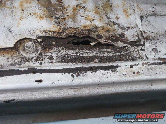 20098-body-work.jpg More evidence of what is going on just below the tub material.  That hole goes all the way through the tub support.  That hole is all the way through the tub support member.