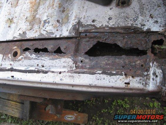Now the damage to the tub  support cross member is evident.  That is only the tip of the ice burgh.  It is totally a loss and needs replacement.  You can't buy a replacement cross member.