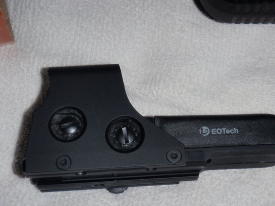 Black EOTech holographic sight with visible adjustment screws and EOTech logo