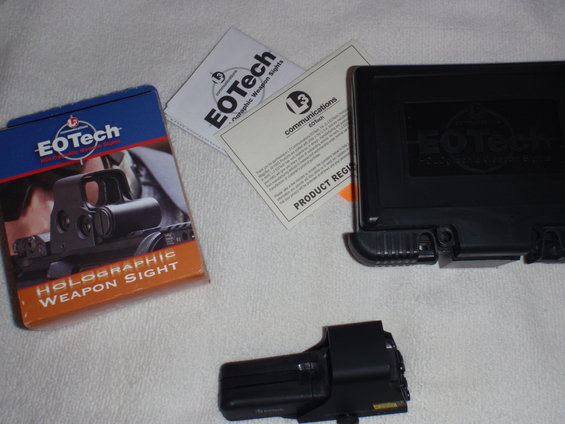 EOTech holographic weapon sight box, paperwork, and the sight itself