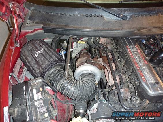 1997 Dodge 2500 engine bay showing Cummins Turbo Diesel valve cover and aftermarket air intake system
