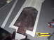 1993 Tracker Tournament - Template being prepared for a custom floor part, with tools laid out on the carpeted surface.