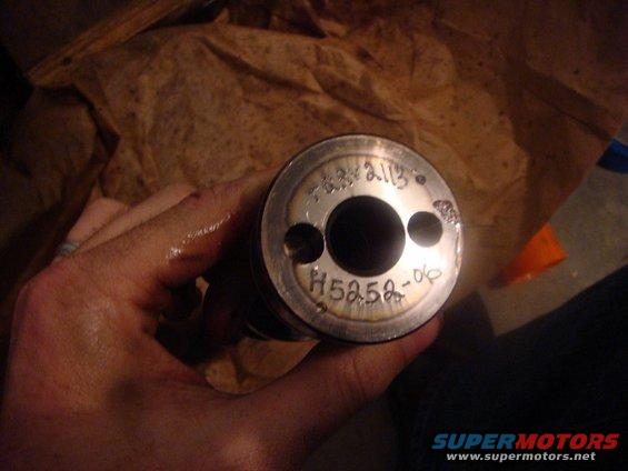 Engine part with stamped numbers H5258-06 and 74372113