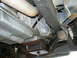 1995 Ford Bronco - Underside of a vehicle, focusing on the transmission and exhaust system.