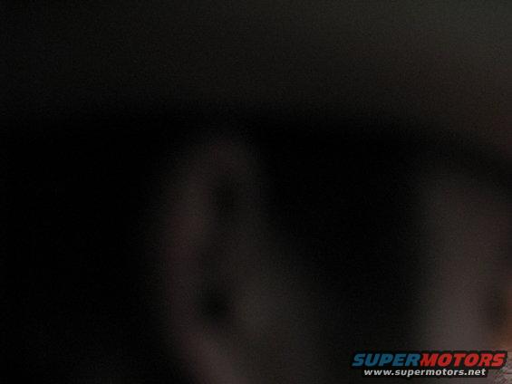 Dark interior shot of a vehicle with a watermark at the bottom right