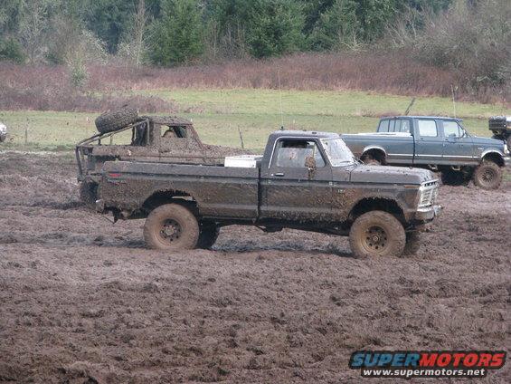 Mud-covered 1979 Ford F-Series pickup truck in mud pit