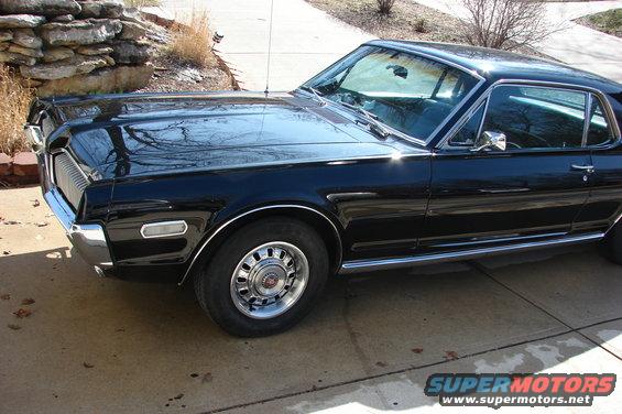 Black 1968 Mercury Cougar parked on a driveway, front quarter view