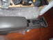 1998 Ford Crown Victoria - The console unit features a gear shifter and cup holders, likely from a vehicle's interior.