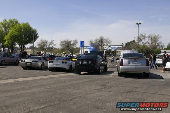 Silver Cadillac CTS parked in a lot with other cars