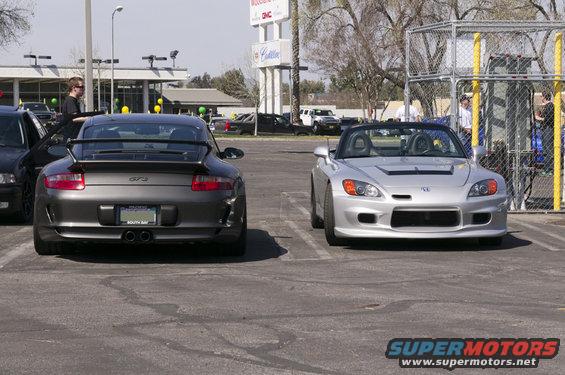 Rear view of a grey Porsche 911 GT3 with a spoiler